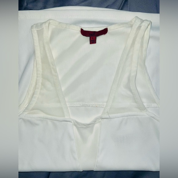Stretchy white tank from buckle size large- fits like a medium or small. - Picture 2 of 2